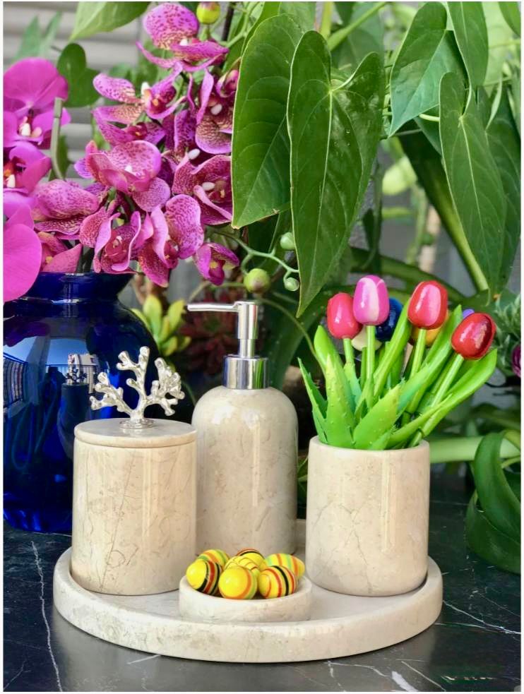 Assos cream marble bath accessories styled with tulips and orchids