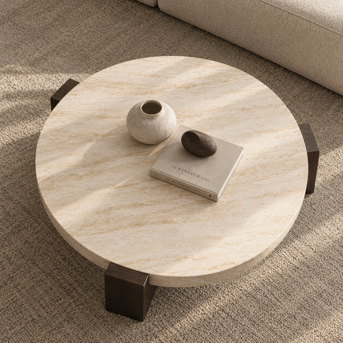 Lycia travertine coffee table with vase and book, close view